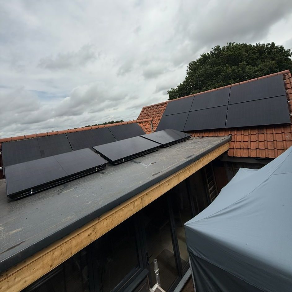 On roof and flat roof solar panels on house in suffolk